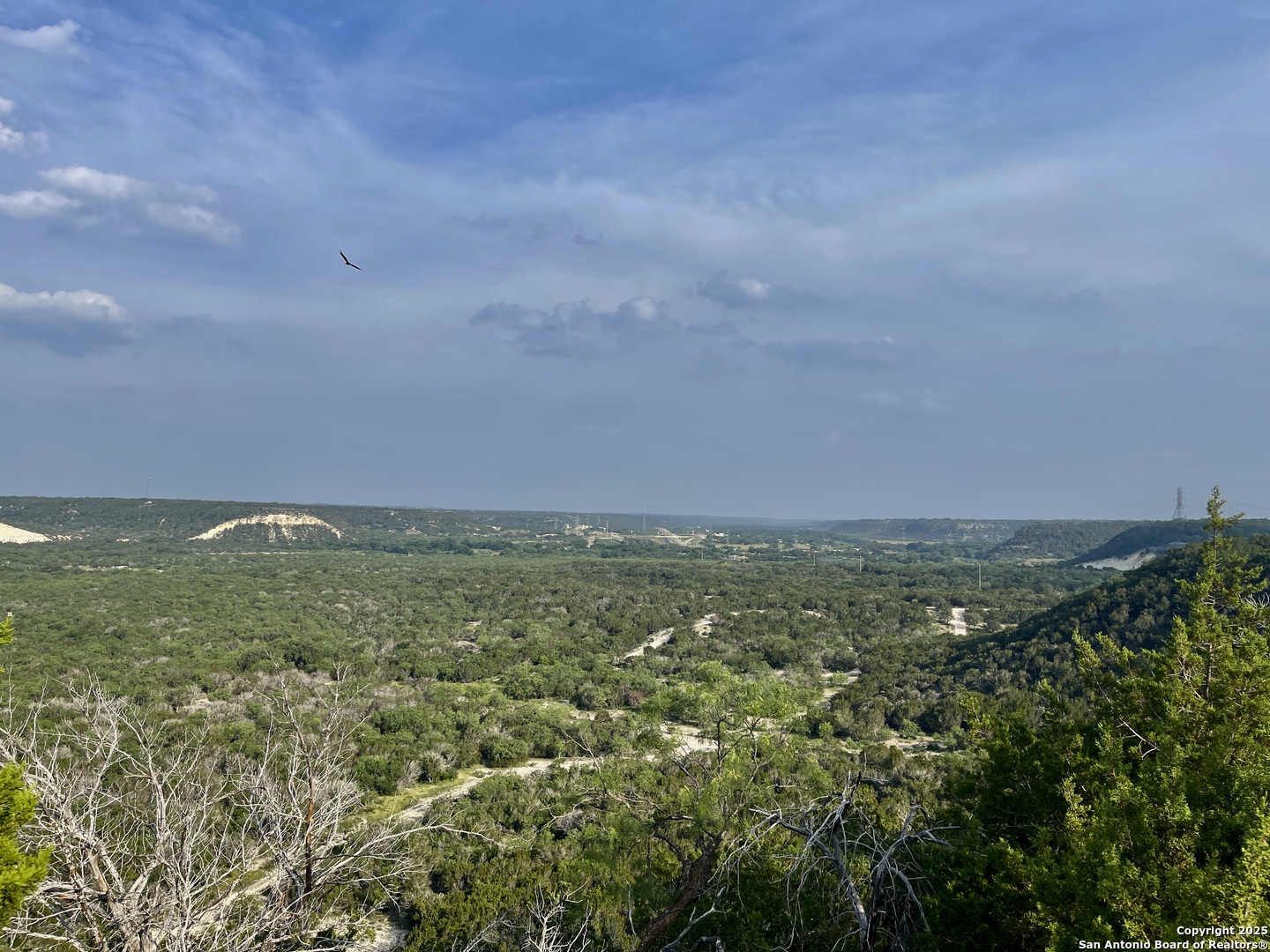 410 Craig Lane Junction, TX 76849 - Photo 16 of 53 a view of a field with an buildings in back