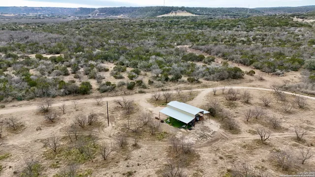 an aerial view of houses with yard
