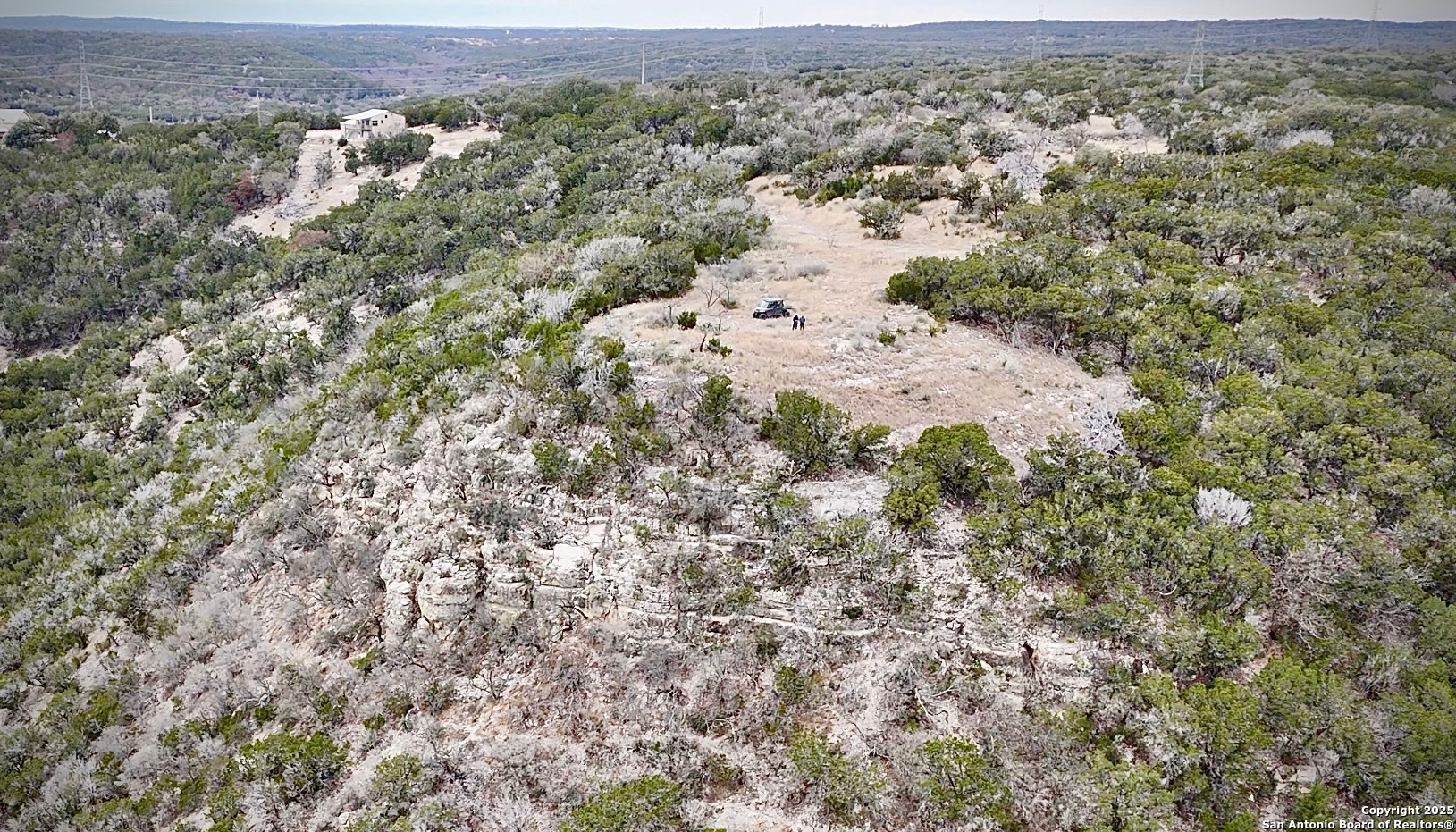 410 Craig Lane Junction, TX 76849 - Photo 41 of 53 an aerial view of house with yard and mountain view in back