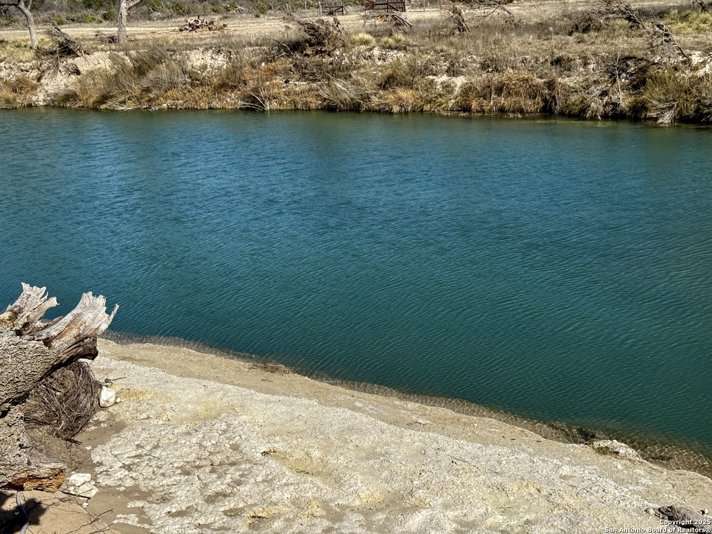 410 Craig Lane Junction, TX 76849 - Photo 44 of 53 a view of a lake from a yard