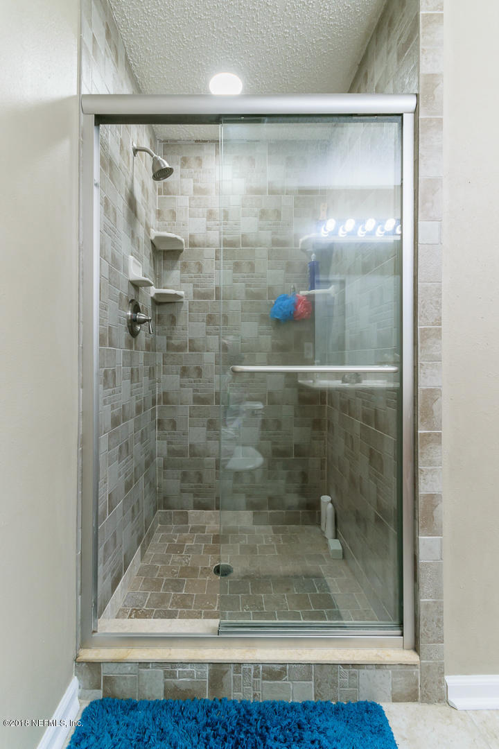 1173 Dawn Light Road Jacksonville, FL 32218 - Photo 15 of 24 a bathroom with a shower