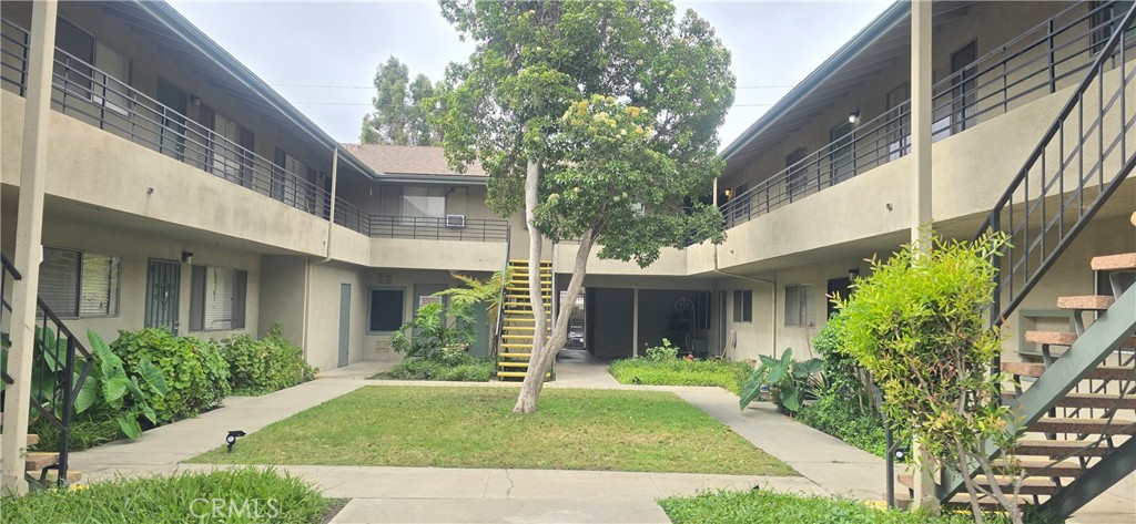 540 East 7th Street, Unit E Upland, CA 91786 - Photo 2 of 9 a view of a white house next to a yard