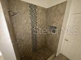 596 Neumann Village Court Ocoee, FL 34761 - Photo 17 of 25 a bathroom with a shower