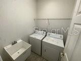 596 Neumann Village Court Ocoee, FL 34761 - Photo 23 of 25 a utility room with dryer and washer