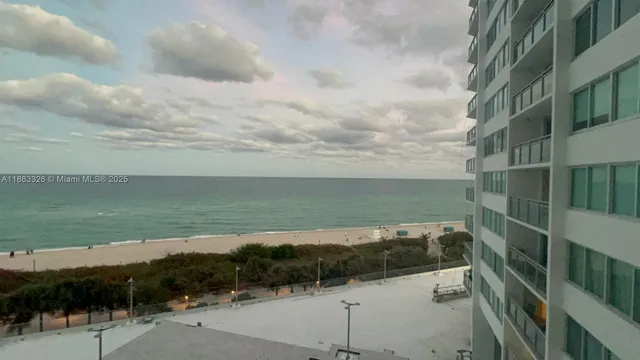 a view of a lake and mountain in front of it