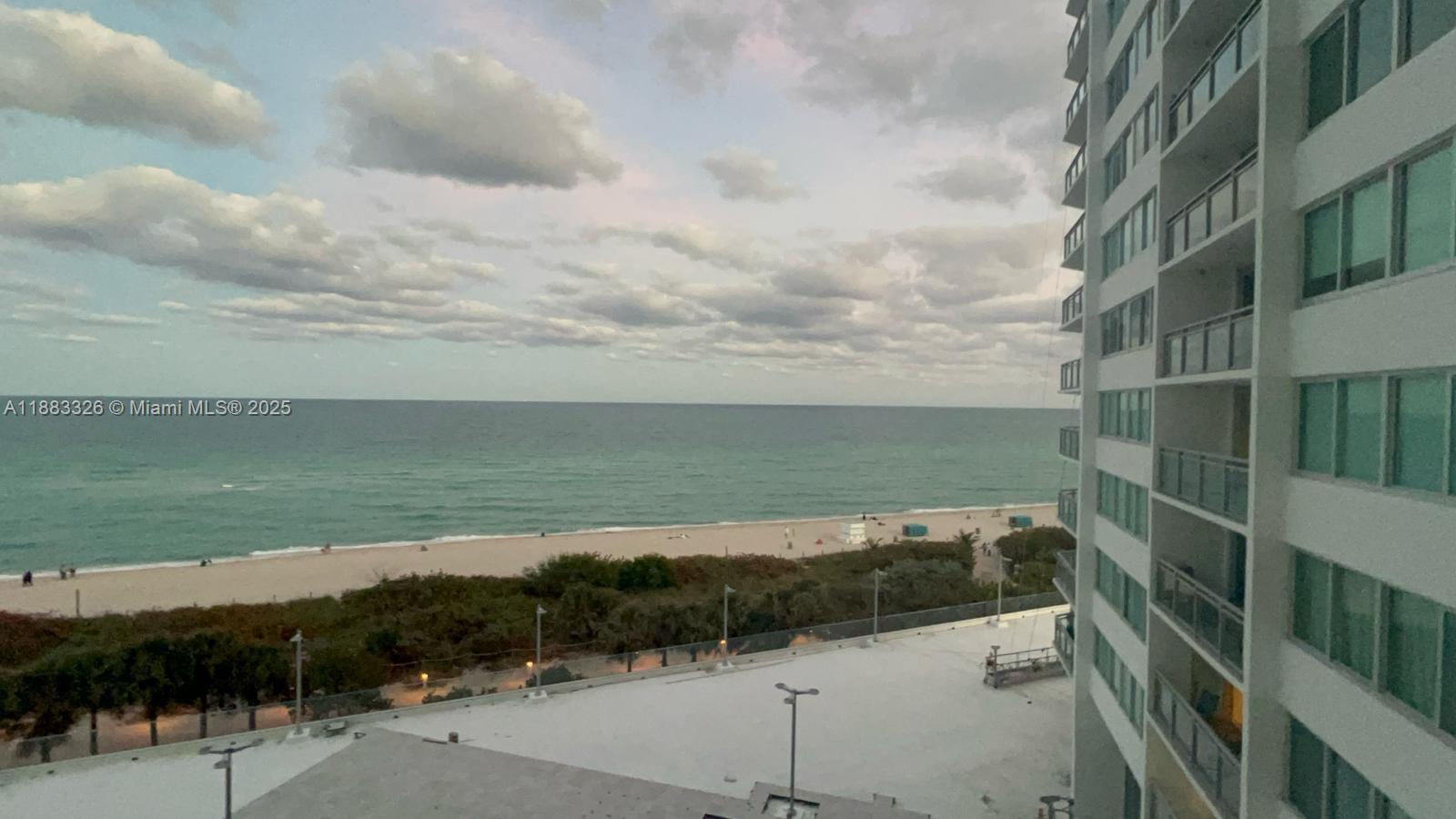 a view of a lake and mountain in front of it