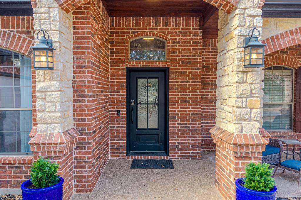9001 Ravenswood Road Granbury, TX 76049 - Photo 5 of 38 View of exterior entry with brick siding