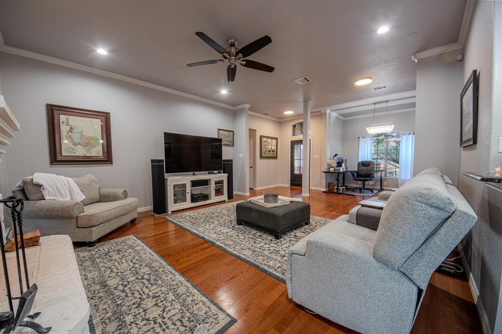 9001 Ravenswood Road Granbury, TX 76049 - Photo 8 of 38 Living area with ornamental molding, hardwood / wood-style flooring, a ceiling fan, and recessed lighting
