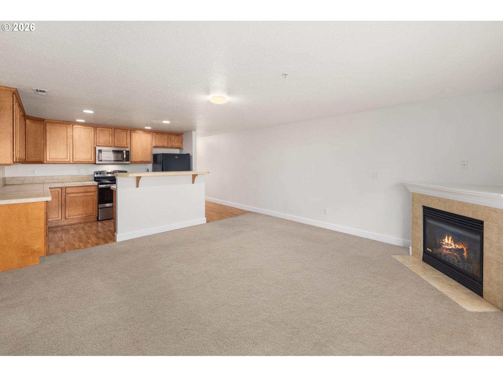 1443 Southeast 8th Avenue Camas, WA 98607 - Photo 20 of 48 a kitchen with a refrigerator a stove top oven and a dishwasher