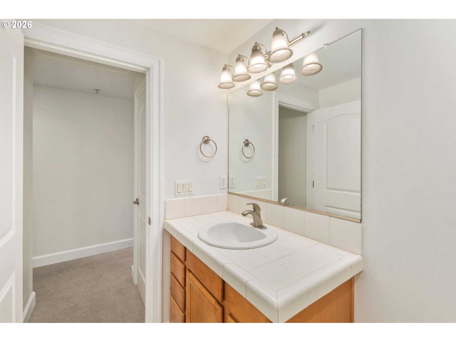 1443 Southeast 8th Avenue Camas, WA 98607 - Photo 35 of 48 a bathroom with a sink vanity and a mirror