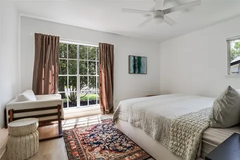 a view of a room with furniture and a window