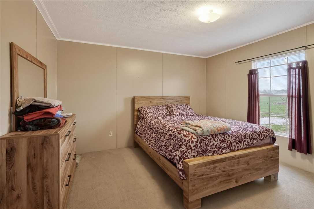 1926 Fairview Road Peebles, OH 45660 - Photo 35 of 44 This spacious bedroom offers a tranquil retreat with ample natural light.