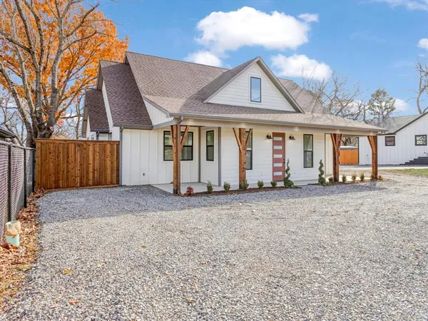 a view of a house with a yard and garage