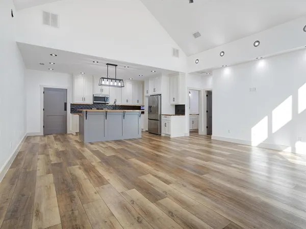 a view of kitchen with wooden floor