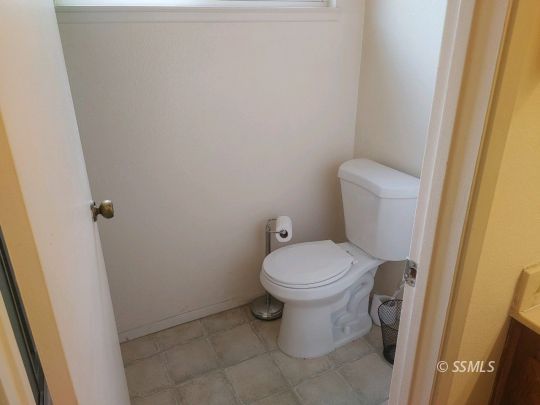 1014 Sherri Street Ridgecrest, CA 93555 - Photo 11 of 23 a white toilet sitting next to a sink