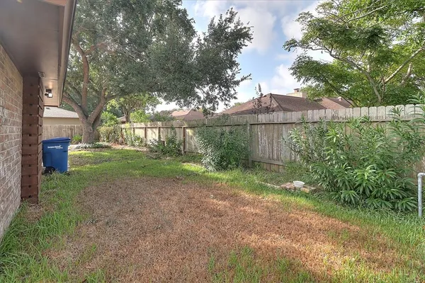 a view of a back yard of the house