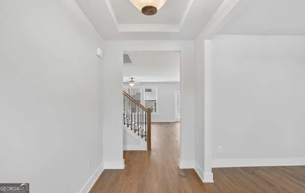 a view of entryway with wooden floor