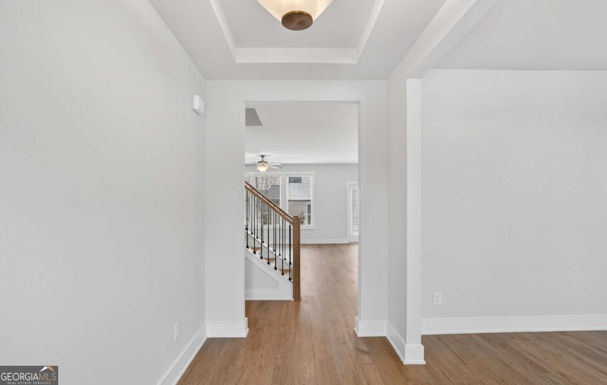 136 Patillo Manor, Unit 9 Stockbridge, GA 30281 - Photo 4 of 18 a view of entryway with wooden floor