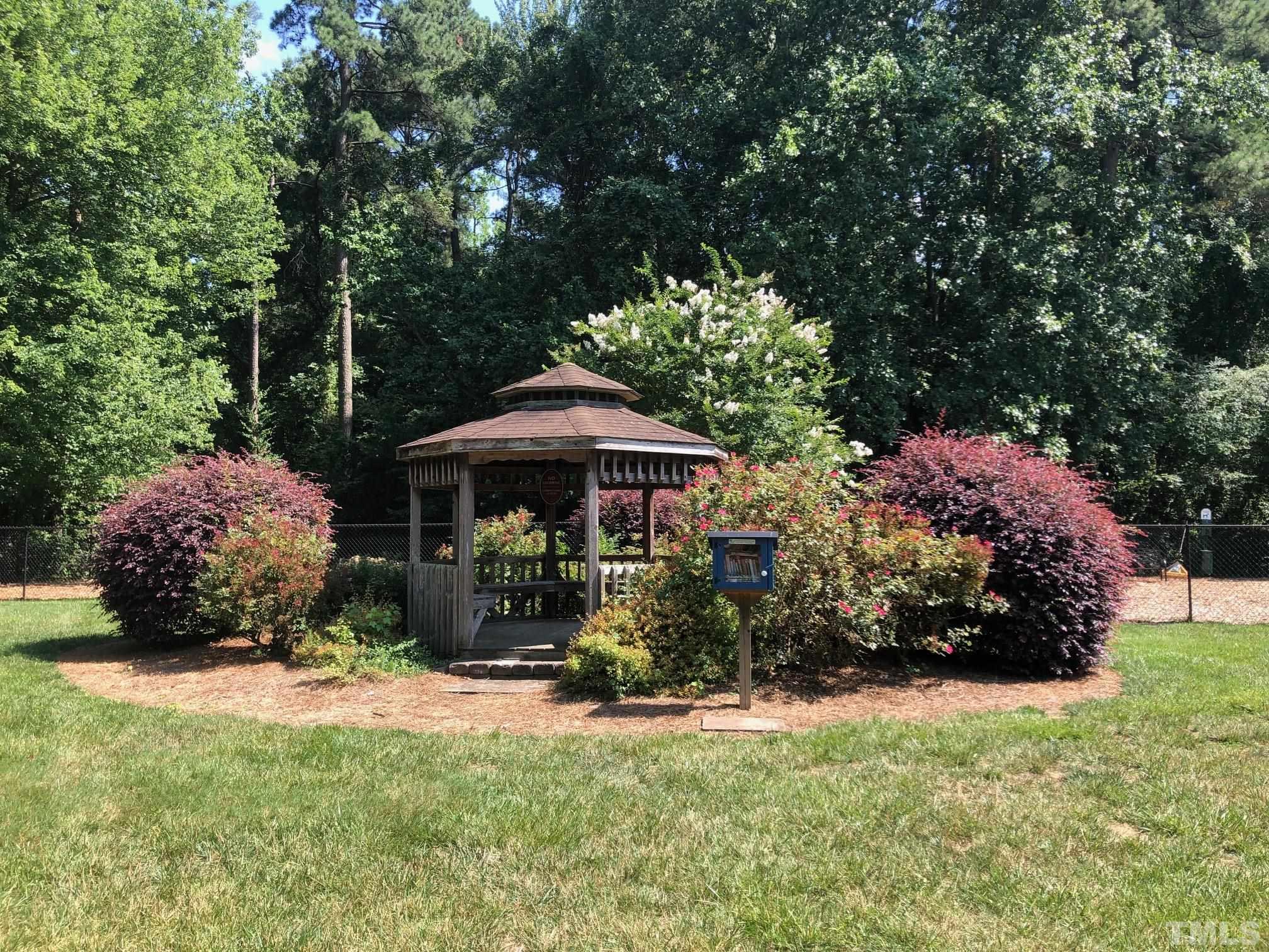 5632 Bridgetowne Way Raleigh, NC 27609 - Photo 23 of 26 a front view of a house with garden