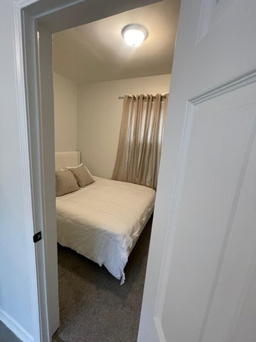 3625 West Shakespeare Avenue, Unit 3 Chicago, IL 60647 - Photo 14 of 21 a bedroom with a bed and a mirror