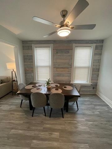 3625 West Shakespeare Avenue, Unit 3 Chicago, IL 60647 - Photo 16 of 21 a view of a dining room with furniture window and wooden floor