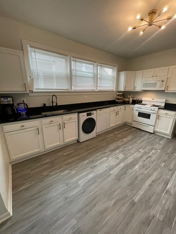 3625 West Shakespeare Avenue, Unit 3 Chicago, IL 60647 - Photo 2 of 21 a kitchen with stainless steel appliances granite countertop a sink and a stove