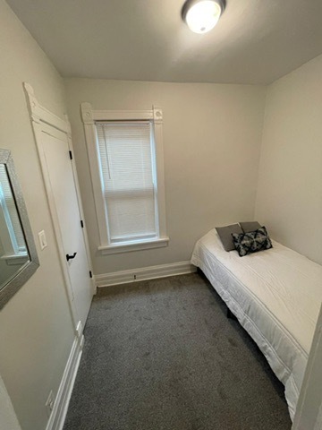 3625 West Shakespeare Avenue, Unit 3 Chicago, IL 60647 - Photo 5 of 21 a bedroom with a bed and a window
