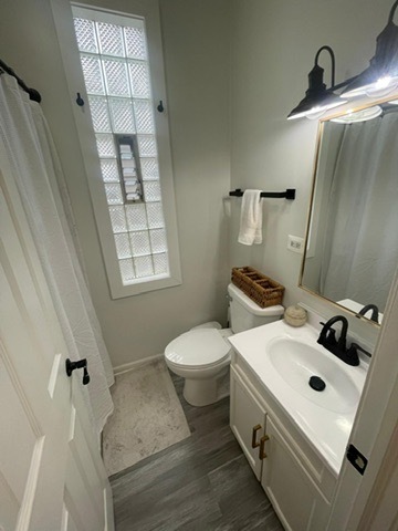 3625 West Shakespeare Avenue, Unit 3 Chicago, IL 60647 - Photo 8 of 21 a bathroom with a sink toilet and shower