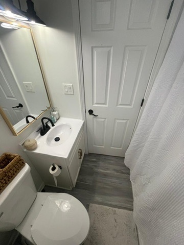 3625 West Shakespeare Avenue, Unit 3 Chicago, IL 60647 - Photo 9 of 21 a bathroom with a sink toilet and shower