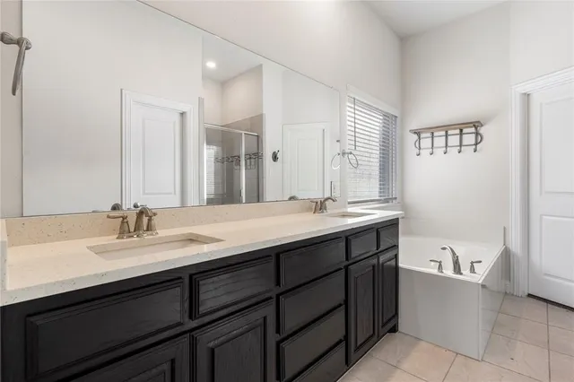 a bathroom with a sink double vanity and a mirror