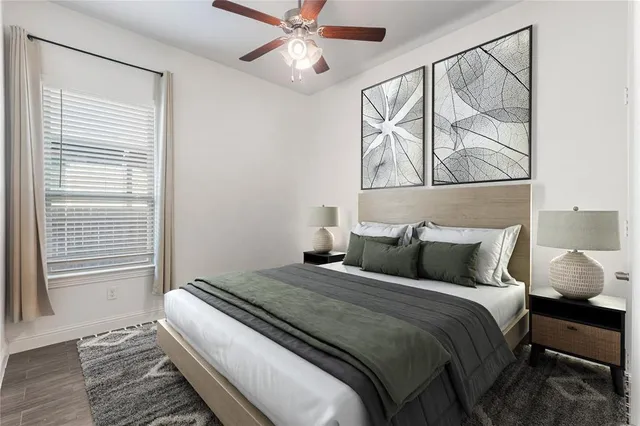 a bedroom with a bed and window