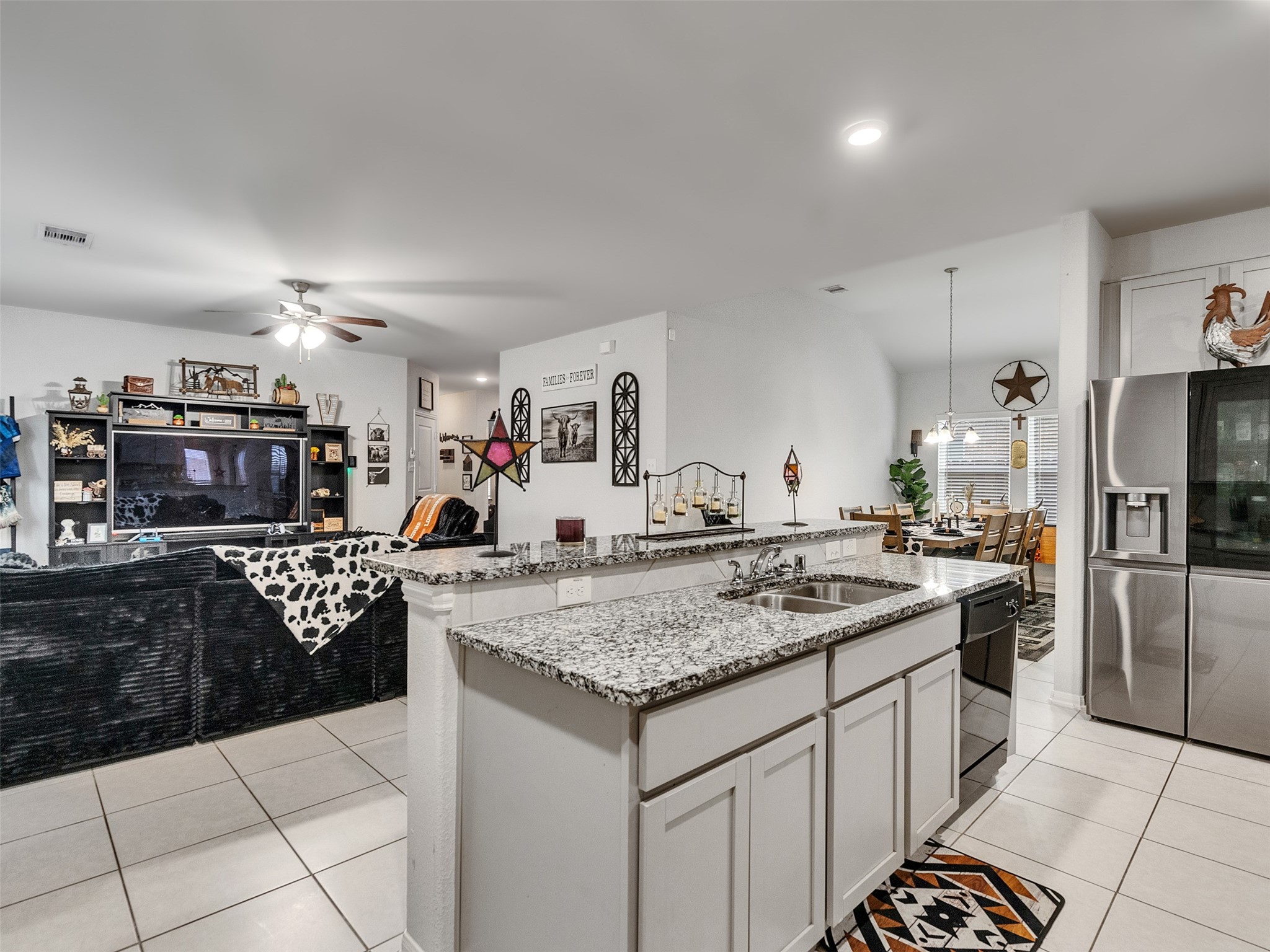 8719 Willet Street Baytown, TX 77521 - Photo 25 of 42 a kitchen with stainless steel appliances granite countertop a sink and cabinets