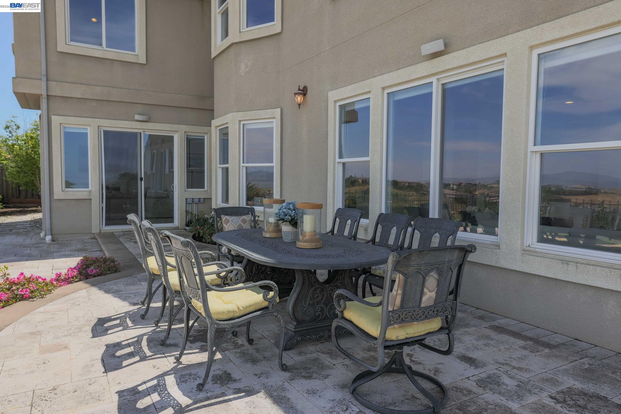 950 Winsford Court San Ramon, CA 94583 - Photo 62 of 68 a view of a patio with table and chairs and potted plants
