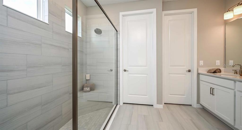 5241 Bowspirit Way St. Cloud, FL 34771 - Photo 10 of 17 a bathroom with a sink and a mirror