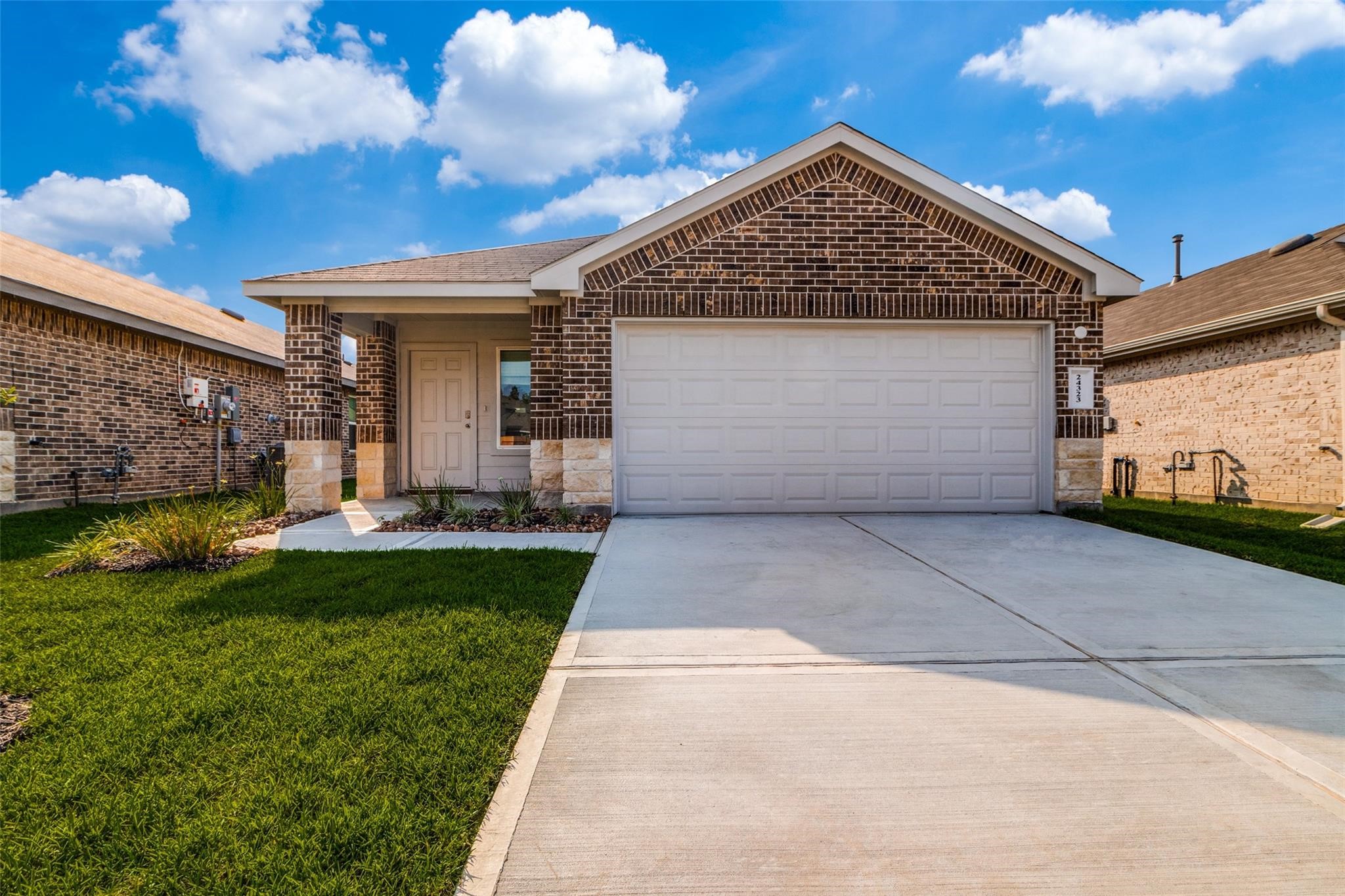 24323 Cayman Heights Lane Spring, TX 77373 - Photo 12 of 12 a front view of a house with garden