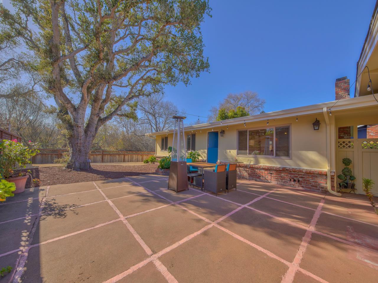 26464 Mission Fields Road Carmel, CA 93923 - Photo 1 of 35 a view of a patio with couches and table and chairs and potted plants