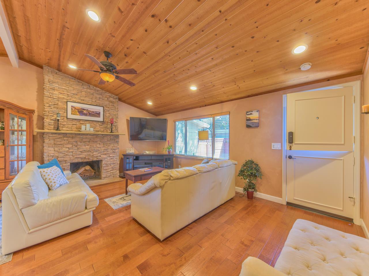 26464 Mission Fields Road Carmel, CA 93923 - Photo 11 of 35 a living room with furniture and a flat screen tv