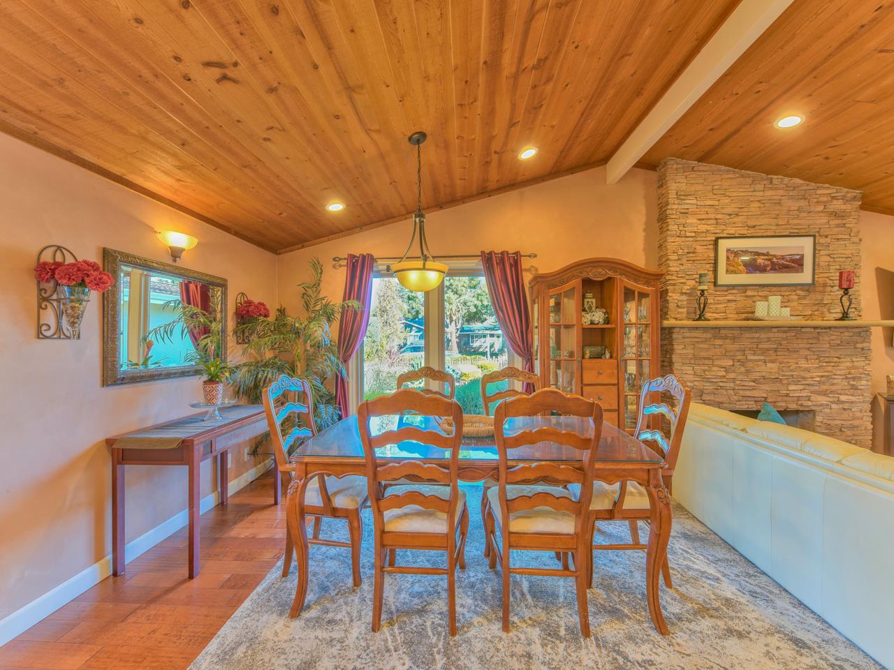 26464 Mission Fields Road Carmel, CA 93923 - Photo 15 of 35 a dining room with furniture and wooden floor