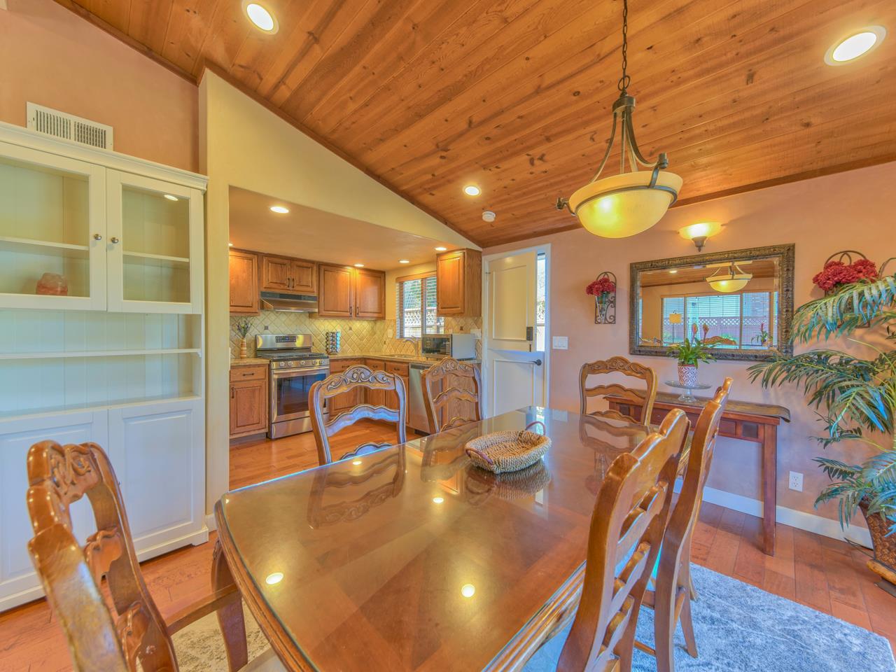 26464 Mission Fields Road Carmel, CA 93923 - Photo 17 of 35 a view of a dining room with furniture and chandelier