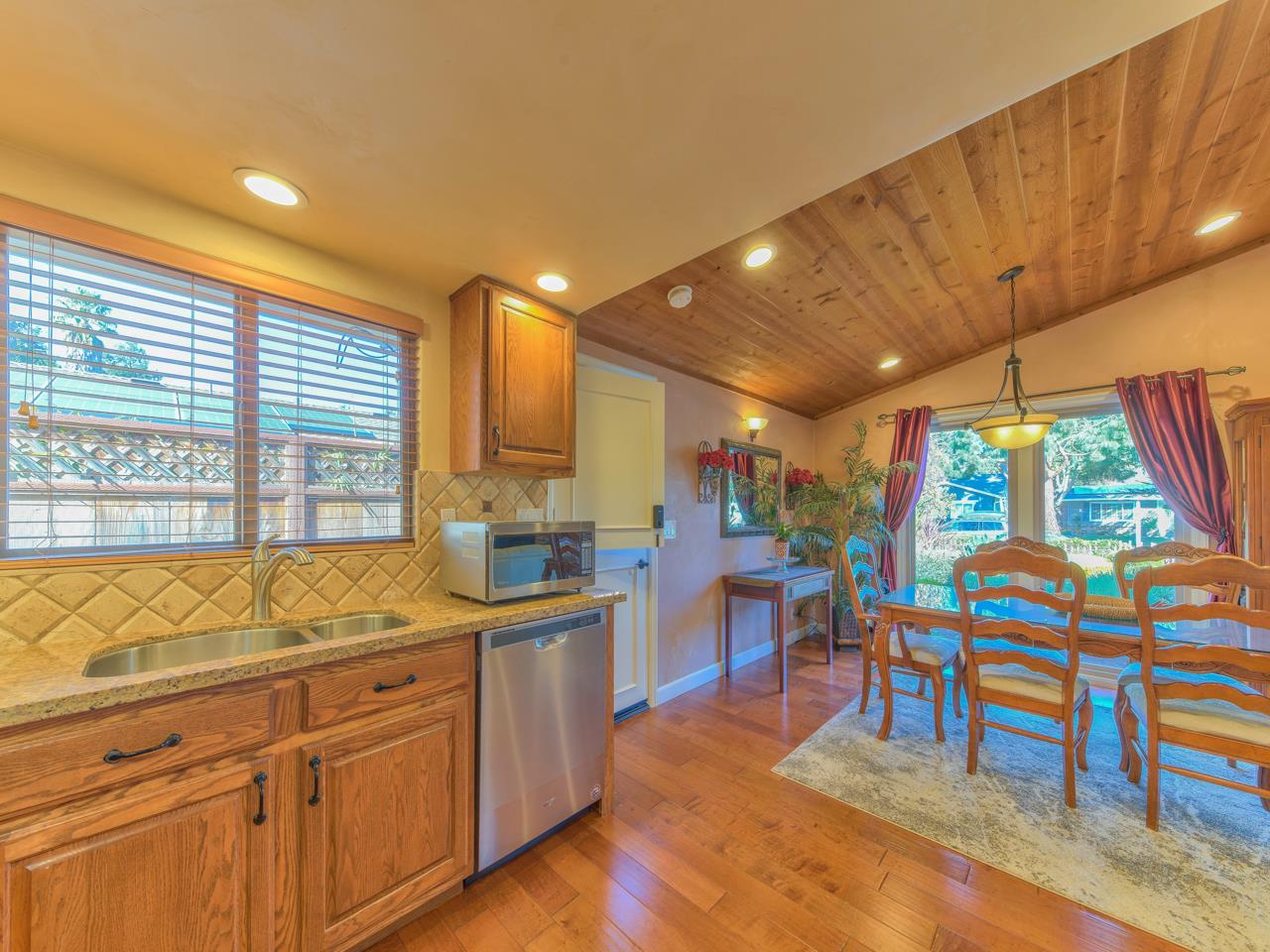 26464 Mission Fields Road Carmel, CA 93923 - Photo 19 of 35 a open kitchen with stainless steel appliances granite countertop a sink and cabinets