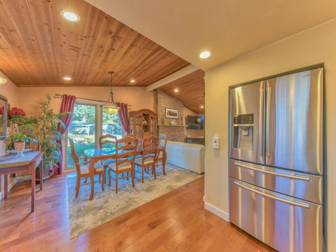 26464 Mission Fields Road Carmel, CA 93923 - Photo 20 of 35 a view of a dining room with furniture window and wooden floor