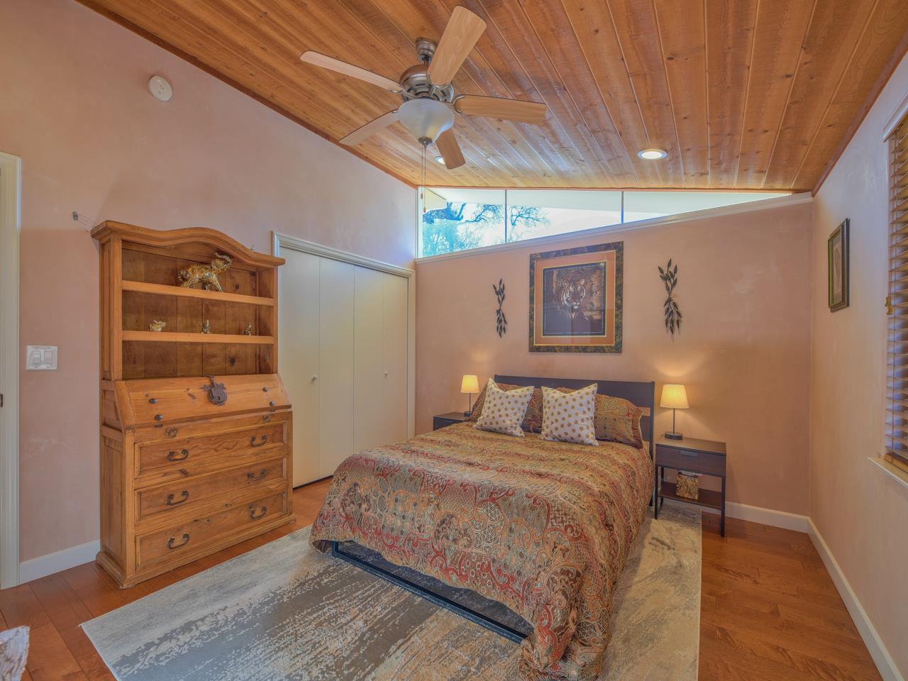 26464 Mission Fields Road Carmel, CA 93923 - Photo 22 of 35 a bedroom with a bed and a dresser