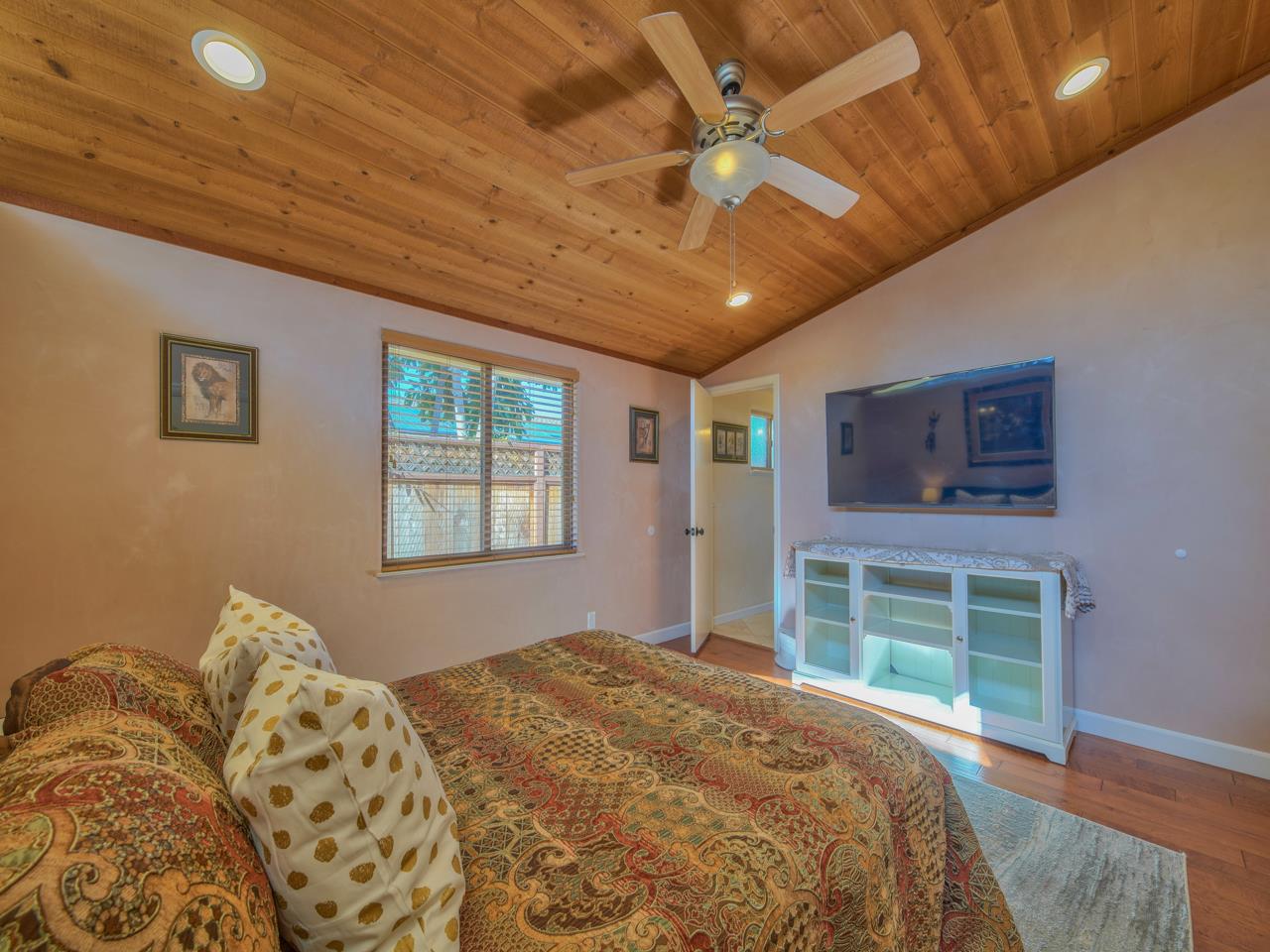 26464 Mission Fields Road Carmel, CA 93923 - Photo 23 of 35 a bedroom with a large bed and a window