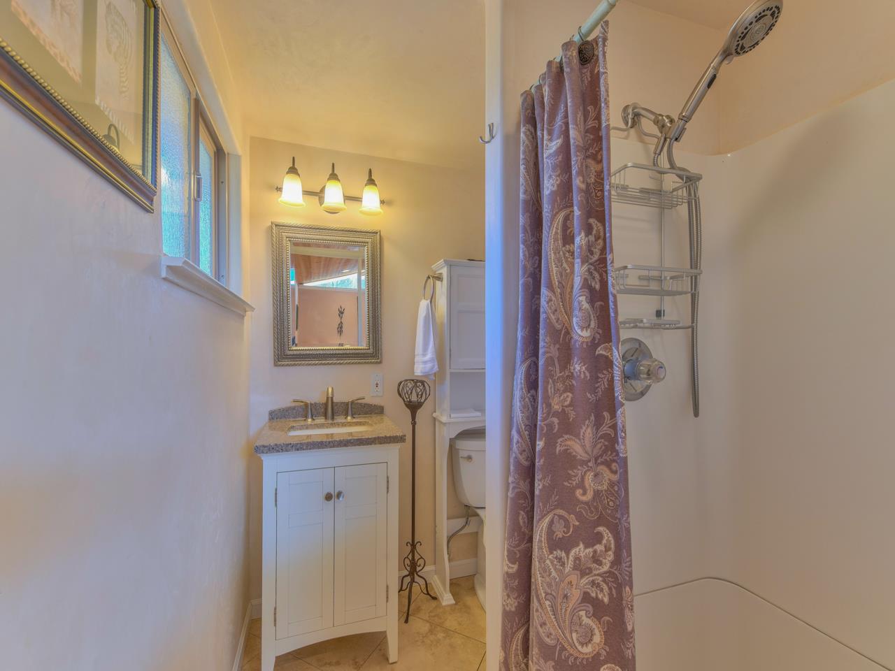26464 Mission Fields Road Carmel, CA 93923 - Photo 25 of 35 a bathroom with a sink vanity and a mirror
