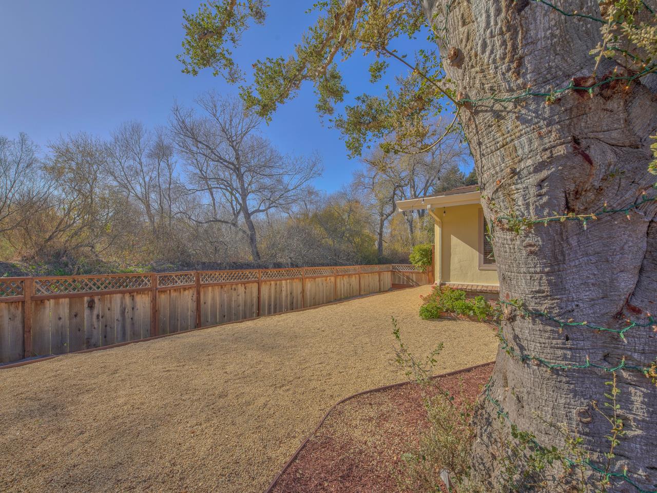 26464 Mission Fields Road Carmel, CA 93923 - Photo 32 of 35 a view of backyard with wooden fence
