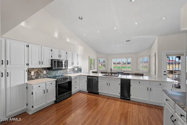 a view of room with hardwood floor and window