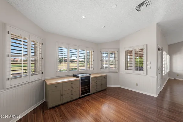 a view of a patio with table and chairs