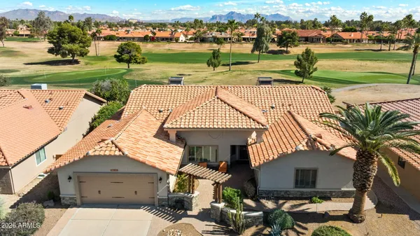an aerial view of a house with a ocean view