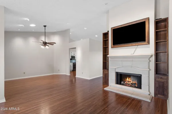 a view of an empty room and wooden floor