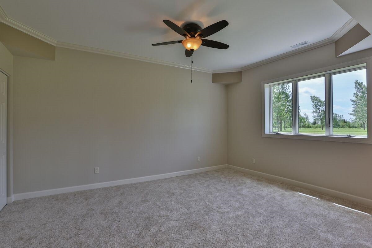 12665 Stateline Road Cedar Lake, IN 46303 - Photo 8 of 10 an empty room with ceiling fan and window